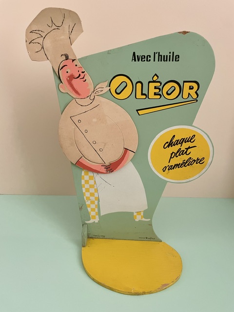 Présentoir publicitaire Oléor « Chaque plat s’améliore » – années 60